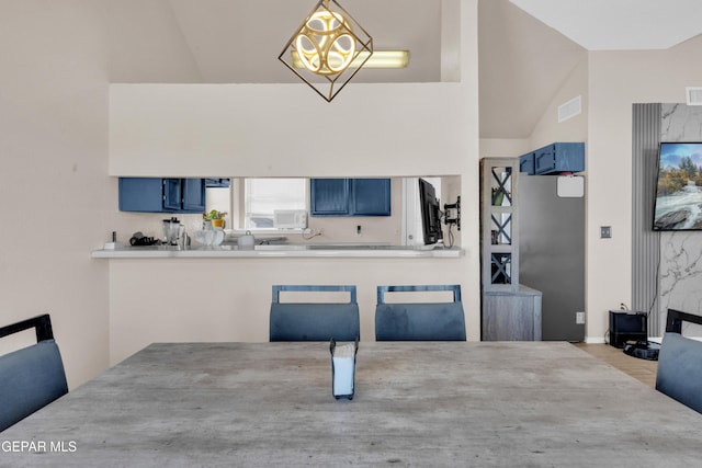 13324 Mitchell Dr, Horizon City, TX 79928 - dining room with lofted ceiling and wood finished floors