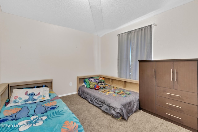 13324 Mitchell Dr, Horizon City, TX 79928 - carpeted bedroom with a textured ceiling and baseboards