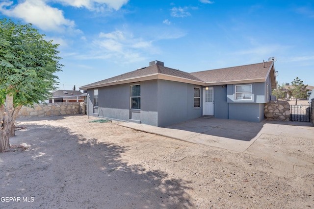 13324 Mitchell Dr, Horizon City, TX 79928 - rear view of property with stucco siding, a patio area, and roof with shingles