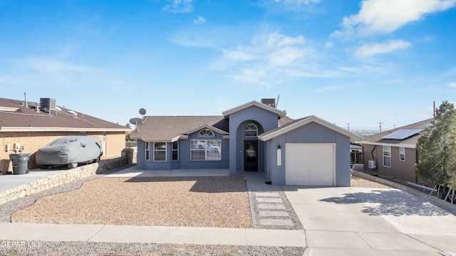 13324 Mitchell Dr, Horizon City, TX 79928 - ranch-style house with an attached garage, driveway, stucco siding, and cooling unit