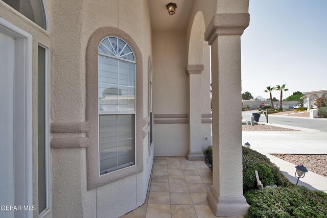 216 Desert Garden Dr, Santa Teresa, NM 88008 - entrance to property featuring stucco siding and a porch