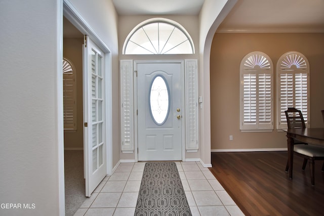 216 Desert Garden Dr, Santa Teresa, NM 88008 - tiled entryway featuring ornamental molding, baseboards, and arched walkways