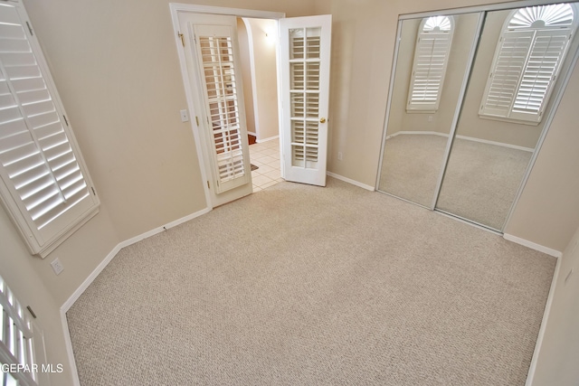 216 Desert Garden Dr, Santa Teresa, NM 88008 - unfurnished bedroom featuring carpet, a closet, and baseboards