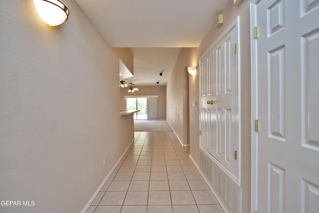 216 Desert Garden Dr, Santa Teresa, NM 88008 - hallway with light tile patterned flooring and baseboards