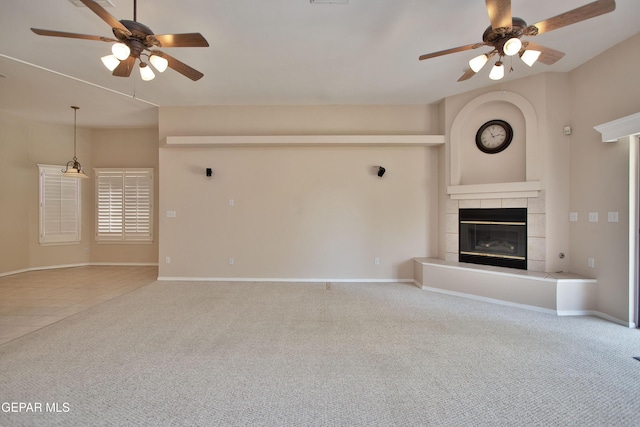 216 Desert Garden Dr, Santa Teresa, NM 88008 - unfurnished living room with a ceiling fan, carpet, a tile fireplace, and baseboards