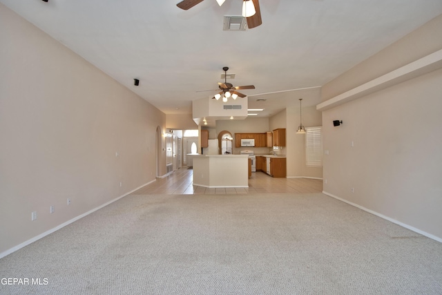 216 Desert Garden Dr, Santa Teresa, NM 88008 - unfurnished living room with ceiling fan, light colored carpet, and baseboards