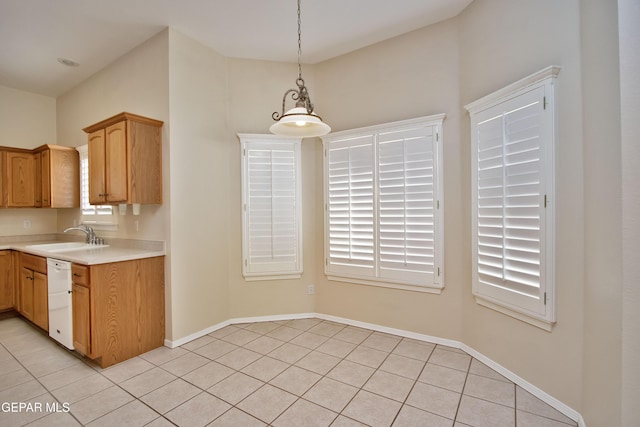216 Desert Garden Dr, Santa Teresa, NM 88008 - kitchen with light tile patterned flooring, light countertops, a sink, dishwasher, and pendant lighting
