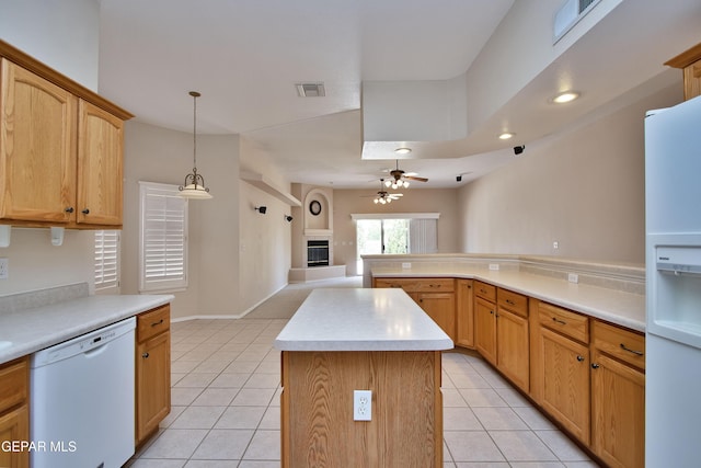 216 Desert Garden Dr, Santa Teresa, NM 88008 - kitchen with white appliances, light tile patterned floors, a ceiling fan, a center island, and open floor plan