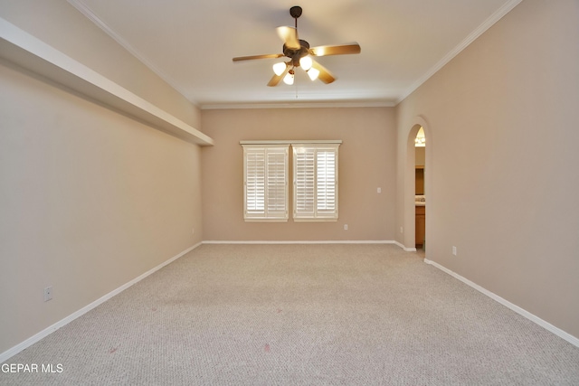 216 Desert Garden Dr, Santa Teresa, NM 88008 - spare room featuring ceiling fan, arched walkways, light colored carpet, ornamental molding, and baseboards