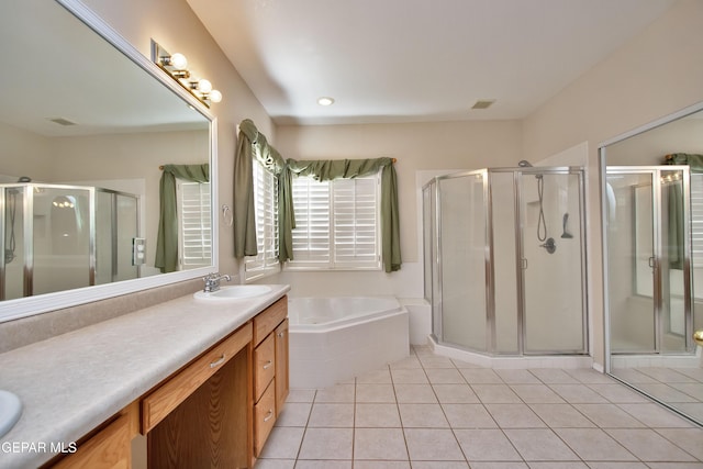216 Desert Garden Dr, Santa Teresa, NM 88008 - bathroom with double vanity, a shower stall, a bath, and tile patterned flooring