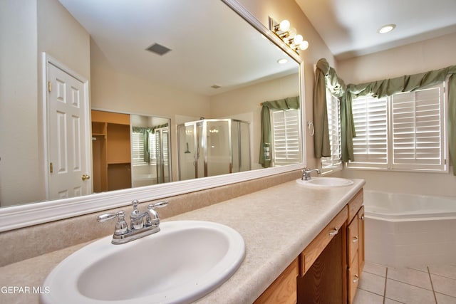 216 Desert Garden Dr, Santa Teresa, NM 88008 - bathroom featuring a stall shower, a bath, double vanity, and tile patterned floors