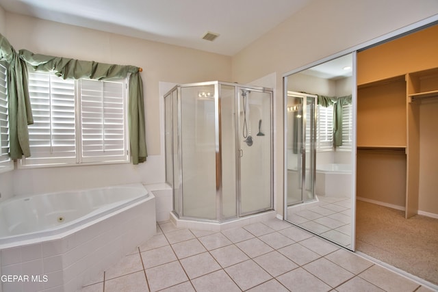 216 Desert Garden Dr, Santa Teresa, NM 88008 - bathroom with a shower stall, a jetted tub, and tile patterned floors