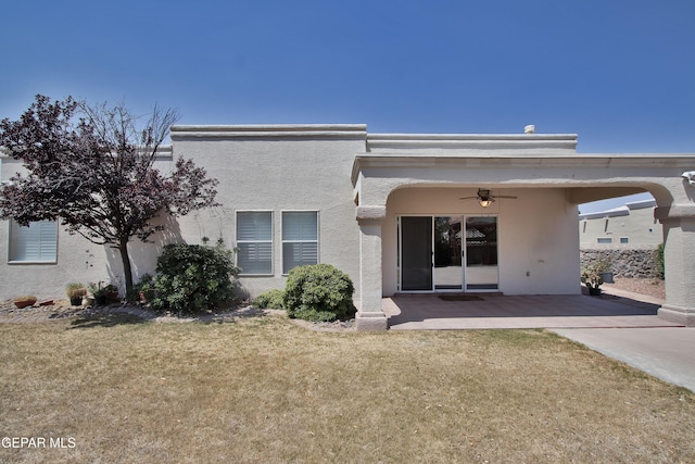 216 Desert Garden Dr, Santa Teresa, NM 88008 - rear view of house featuring ceiling fan, a patio area, stucco siding, and a lawn