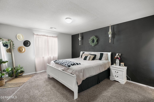 11562 Flor Gloriosa Dr, Socorro, TX 79927 - bedroom featuring carpet, a textured ceiling, and baseboards
