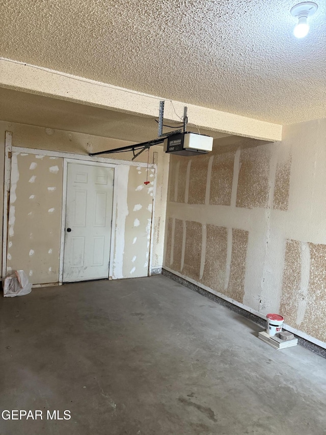 3910 Quasar Ct, El Paso, TX 79904 - garage featuring a garage door opener