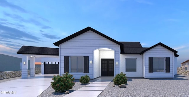 1861 War Path Dr, El Paso, TX 79911 - view of front of home with driveway and a shingled roof