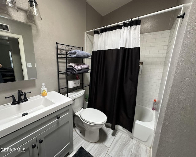 5028 Sagittarius Ave, El Paso, TX 79924 - bathroom with a textured wall, toilet, vanity, and shower / tub combo with curtain