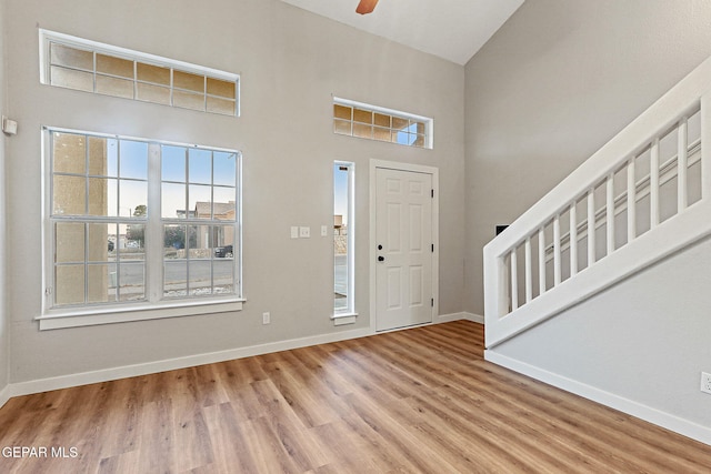 5965 Katelyn Gray Cir, El Paso, TX 79924 - foyer featuring wood finished floors, baseboards, a ceiling fan, and a towering ceiling