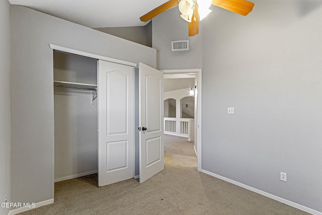 5965 Katelyn Gray Cir, El Paso, TX 79924 - unfurnished bedroom featuring light carpet, a closet, lofted ceiling, baseboards, and ceiling fan