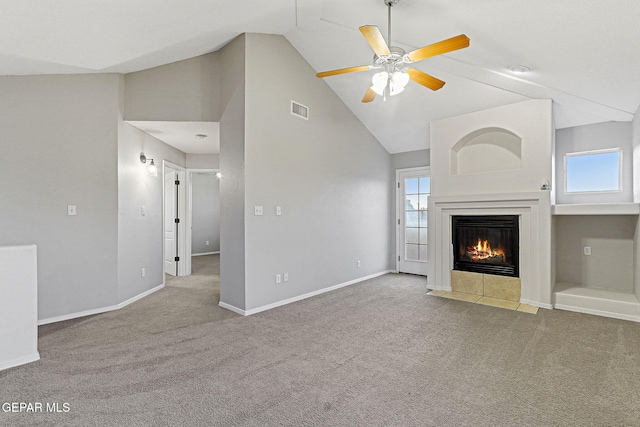 5965 Katelyn Gray Cir, El Paso, TX 79924 - unfurnished living room featuring carpet floors, a tile fireplace, a ceiling fan, baseboards, and high vaulted ceiling