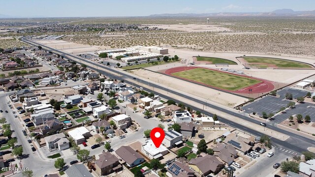14156 Warren Belin Dr, Horizon City, TX 79928 - aerial overview of property's location featuring a mountain backdrop and nearby suburban area