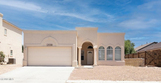 14156 Warren Belin Dr, Horizon City, TX 79928 - view of front of house featuring stucco siding, cooling unit, concrete driveway, and a garage