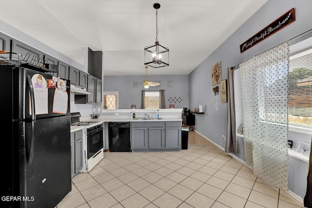 14156 Warren Belin Dr, Horizon City, TX 79928 - kitchen with black appliances, a peninsula, under cabinet range hood, light countertops, and gray cabinets