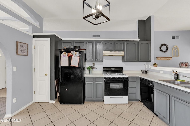 14156 Warren Belin Dr, Horizon City, TX 79928 - kitchen with black appliances, under cabinet range hood, gray cabinets, and arched walkways
