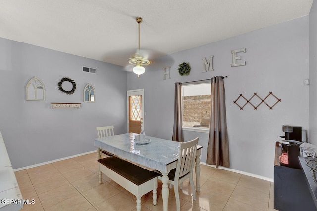 14156 Warren Belin Dr, Horizon City, TX 79928 - dining room with ceiling fan, light tile patterned floors, and baseboards