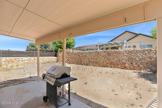 14156 Warren Belin Dr, Horizon City, TX 79928 - fenced backyard with a patio and grilling area