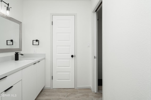 6608 Los Altos Dr, El Paso, TX 79912 - bathroom featuring vanity and baseboards
