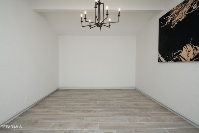 6608 Los Altos Dr, El Paso, TX 79912 - unfurnished dining area featuring a chandelier and wood finished floors