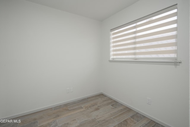 6608 Los Altos Dr, El Paso, TX 79912 - empty room with wood tiled floors and baseboards