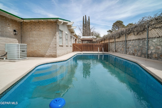 6608 Los Altos Dr, El Paso, TX 79912 - view of swimming pool featuring central air condition unit