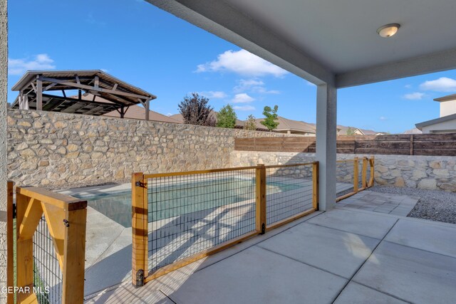 2174 Enchanted Crest Dr, El Paso, TX 79911 - fenced backyard featuring a patio area
