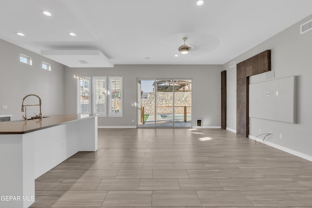2174 Enchanted Crest Dr, El Paso, TX 79911 - kitchen with open floor plan, plenty of natural light, recessed lighting, baseboards, and a sink