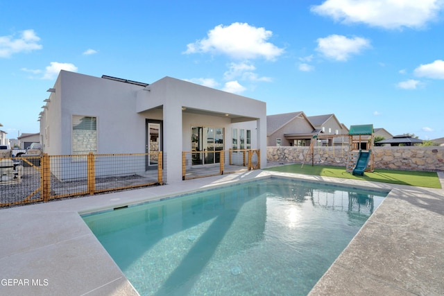 2174 Enchanted Crest Dr, El Paso, TX 79911 - view of pool with a playground, a patio area, and a residential view