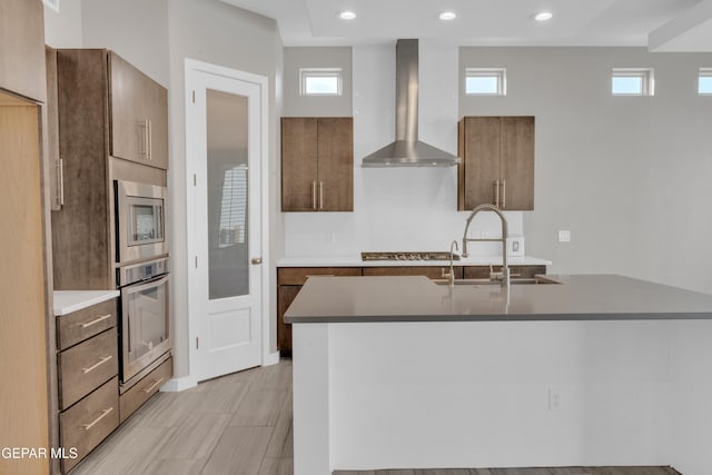 2174 Enchanted Crest Dr, El Paso, TX 79911 - kitchen featuring stainless steel appliances, wall chimney range hood, a sink, healthy amount of natural light, and recessed lighting