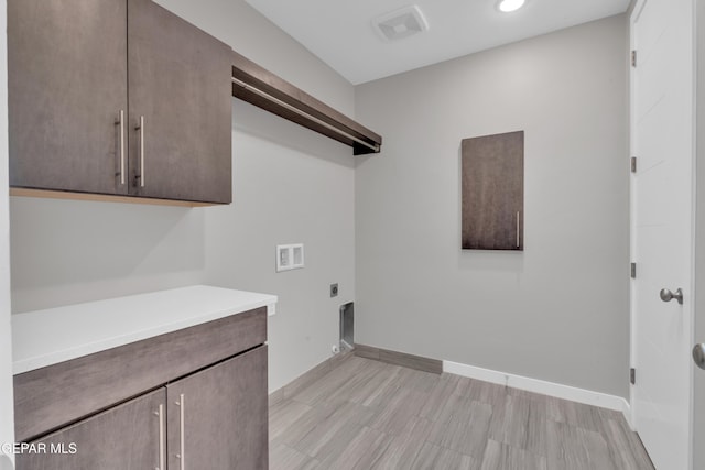 2174 Enchanted Crest Dr, El Paso, TX 79911 - laundry room with hookup for an electric dryer, hookup for a washing machine, cabinet space, baseboards, and recessed lighting