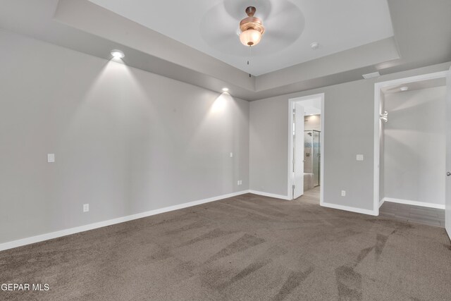 2174 Enchanted Crest Dr, El Paso, TX 79911 - carpeted empty room with ceiling fan, a tray ceiling, and baseboards