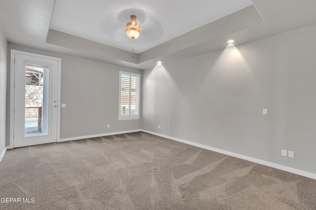 2174 Enchanted Crest Dr, El Paso, TX 79911 - carpeted spare room featuring a ceiling fan, baseboards, and a raised ceiling
