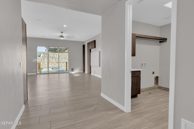 2174 Enchanted Crest Dr, El Paso, TX 79911 - corridor featuring baseboards and light wood-type flooring