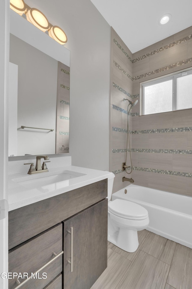 2174 Enchanted Crest Dr, El Paso, TX 79911 - bathroom with vanity, shower / tub combination, and toilet