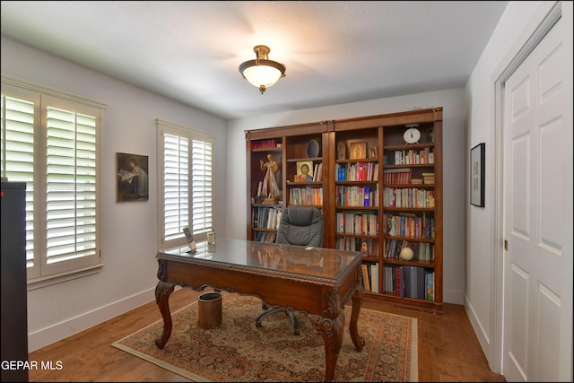 4490 Shadow Willow Dr, El Paso, TX 79922 - home office with baseboards and wood finished floors