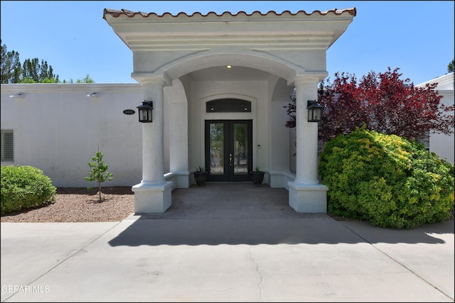 4490 Shadow Willow Dr, El Paso, TX 79922 - view of exterior entry featuring french doors and stucco siding