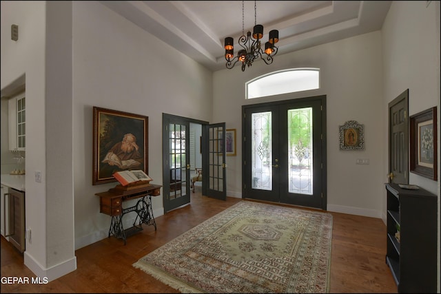 4490 Shadow Willow Dr, El Paso, TX 79922 - foyer with french doors, a towering ceiling, a chandelier, wood finished floors, and a raised ceiling
