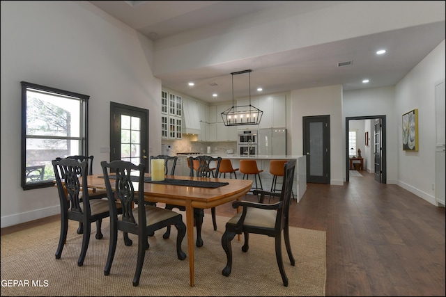 4490 Shadow Willow Dr, El Paso, TX 79922 - dining room with dark wood-style flooring, baseboards, recessed lighting, and a chandelier