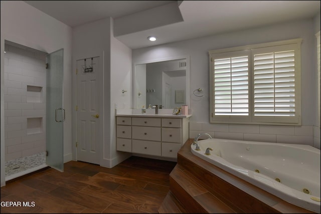 4490 Shadow Willow Dr, El Paso, TX 79922 - full bathroom featuring a stall shower, vanity, a tub with jets, and wood finished floors