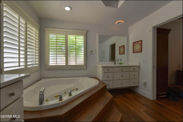 4490 Shadow Willow Dr, El Paso, TX 79922 - full bath featuring vanity, a jetted tub, wood finished floors, and baseboards