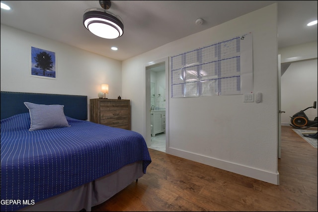 4490 Shadow Willow Dr, El Paso, TX 79922 - bedroom with wood finished floors, baseboards, connected bathroom, and recessed lighting